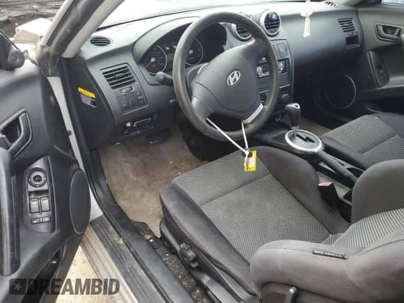 2006 Hyundai Tiburon GS with VIN KMHHM65D76U223977, listed as a Copart auction lot 50953134 with 41,078 mi miles and Salvage title. Bid and sale history available at DreamBid. Image 8.