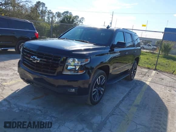 2018 Chevrolet Tahoe Premier with VIN 1GNSKCKJ3JR189371, listed as a IAAI auction lot 41707865 with 112,383 mi miles and . Bid and sale history available at DreamBid. Image 2.