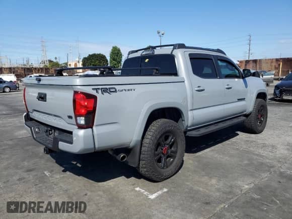 2018 Toyota Tacoma TRD Sport with VIN 3TMAZ5CNXJM074796, listed as a Copart auction lot 84055345 with 79,231 mi miles and Salvage title. Bid and sale history available at DreamBid. Image 3.