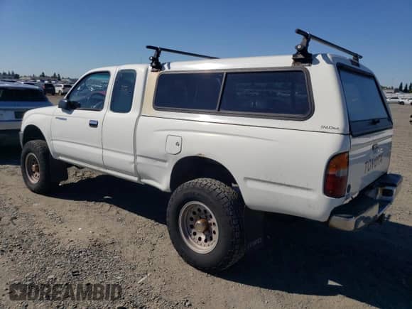 1997 Toyota Tacoma with VIN 4TAWN72N1VZ242680, listed as a Copart auction lot 85537735 with 218,563 mi miles and Clean title. Bid and sale history available at DreamBid. Image 2.