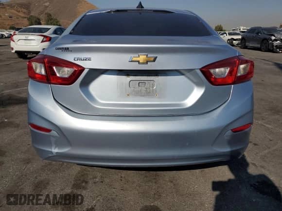 2018 Chevrolet Cruze LS with VIN 1G1BC5SM9J7201927, listed as a Copart auction lot 68142085 with 94,065 mi miles and Salvage title. Bid and sale history available at DreamBid. Image 6.