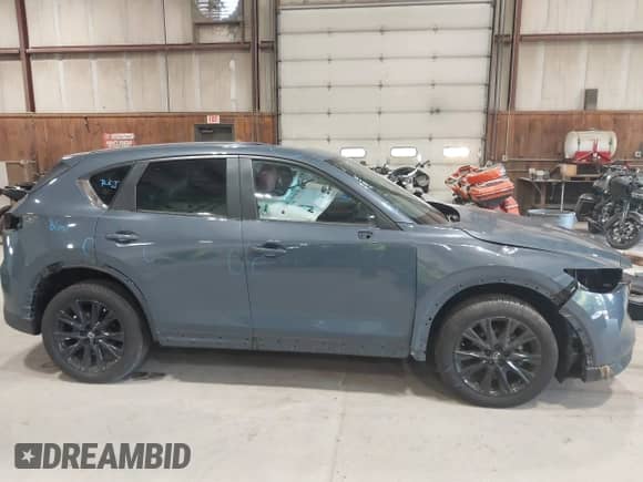 2024 Mazda CX-5 S Preferred z VIN JM3KFBCM0R0398834, wystawiony jako IAAI lot #42841174 z przebiegiem 6 031 mil mil oraz . Historia ofert i sprzedaży dostępna na DreamBid. Obrazek 20.