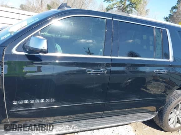 2019 Chevrolet Suburban Premier with VIN 1GNSCJKC5KR360318, listed as a IAAI auction lot 41504344 with 82,997 mi miles and . Bid and sale history available at DreamBid. Image 14.