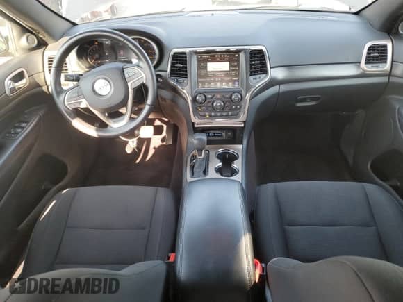 2016 Jeep Grand Cherokee Laredo with VIN 1C4RJFAG2GC379787, listed as a Copart auction lot 84704385 with 112,063 mi miles and Salvage title. Bid and sale history available at DreamBid. Image 8.