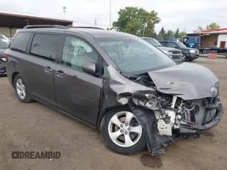 2015 Toyota Sienna LE with VIN 5TDKK3DC9FS582212, listed as a IAAI auction lot 43422573 with 127,449 mi miles and . Bid and sale history available at DreamBid. Image 1.