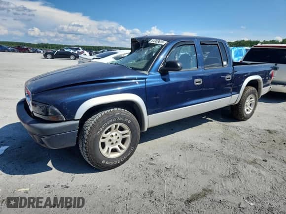 2004 Dodge Dakota SLT with VIN 1D7HL48N74S651434, listed as a Copart auction lot 64309615 with 186,134 mi miles and Salvage title. Bid and sale history available at DreamBid. Image 1.