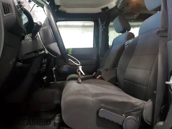 2012 Jeep Wrangler Sport with VIN 1C4AJWAG4CL215593, listed as a Copart auction lot 71013325 with 112,333 mi miles and Salvage title. Bid and sale history available at DreamBid. Image 7.