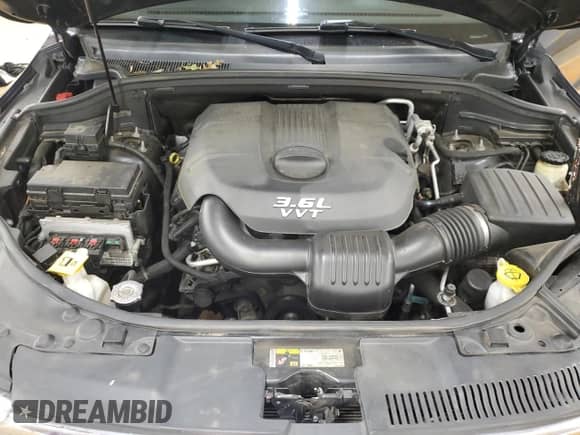 2013 Dodge Durango Crew with VIN 1C4RDJDG9DC682700, listed as a Copart auction lot 68078015 with 169,828 mi miles and Salvage title. Bid and sale history available at DreamBid. Image 12.
