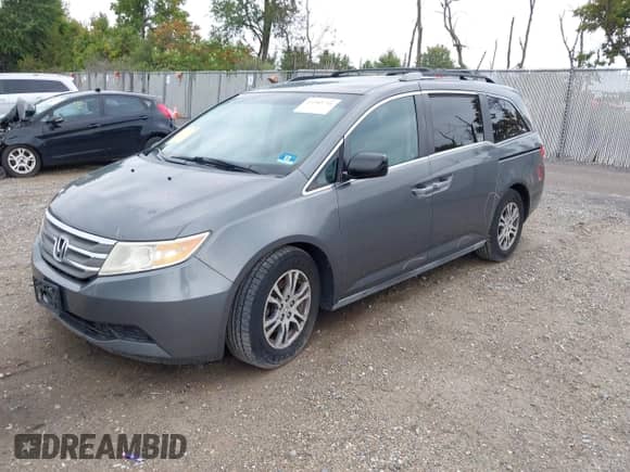 2012 Honda Odyssey EX z VIN 5FNRL5H40CB083650, wystawiony jako IAAI lot #43283741 z przebiegiem 164 693 mil mil oraz . Historia ofert i sprzedaży dostępna na DreamBid. Obrazek 2.