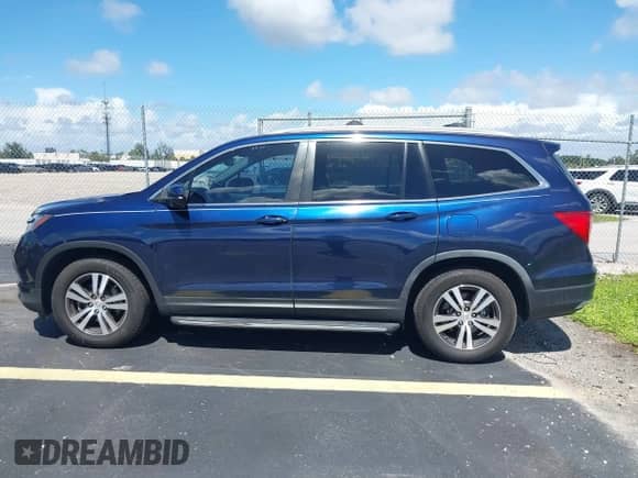 2017 Honda Pilot EX-L with VIN 5FNYF5H52HB019855, listed as a IAAI auction lot 43366867 with 121,526 mi miles and . Bid and sale history available at DreamBid. Image 14.