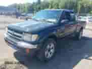 2000 Toyota Tacoma with VIN 4TAWM72N7YZ683933, listed as a IAAI auction lot 43154039 with 234,697 mi miles and . Bid and sale history available at DreamBid. Image 2.