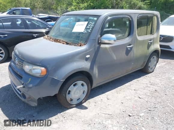 2013 Nissan Cube S z VIN JN8AZ2KR6DT304153, wystawiony jako IAAI lot #42045867 z przebiegiem 174 214 mil mil oraz . Historia ofert i sprzedaży dostępna na DreamBid. Obrazek 2.