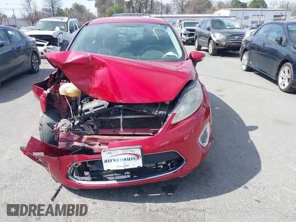 2012 Ford Fiesta SES with VIN 3FADP4FJXCM117791, listed as a IAAI auction lot 41829940 with Not provided miles and . Bid and sale history available at DreamBid. Image 12.