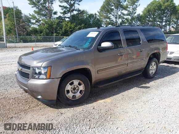 2011 Chevrolet Suburban LT z VIN 1GNSCJE09BR344091, wystawiony jako IAAI lot #43487649 z przebiegiem 182 652 mil mil oraz . Historia ofert i sprzedaży dostępna na DreamBid. Obrazek 2.