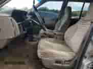 1995 Jeep Grand Cherokee Laredo with VIN 1J4GZ58S2SC703196, listed as a Copart auction lot 68571944 with 264,876 mi miles and Clean title. Bid and sale history available at DreamBid. Image 7.