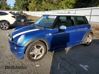 2006 MINI Hardtop with VIN WMWRC33536TJ76990, listed as a Copart auction lot 86487285 with 116,777 mi miles and Salvage title. Bid and sale history available at DreamBid. Image 1.
