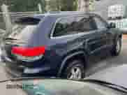 2014 Jeep Grand Cherokee Laredo z VIN 1C4RJFAG0EC109809, wystawiony jako Copart lot #86532235 z przebiegiem 251 606 mil mil oraz Czysty tytuł • Clean title. Historia ofert i sprzedaży dostępna na DreamBid. Obrazek 4.