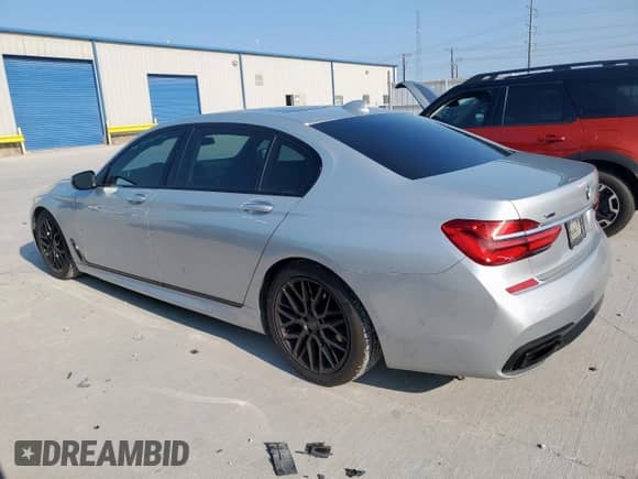 2017 BMW 7 Series 740i xDrive с VIN WBA7E4C58HGU99600, выставлен на аукционе Copart как лот 71171785 с пробегом 91 563 миль миль и Списание • Salvage title. История ставок и продаж доступна на DreamBid. Изображение 2.