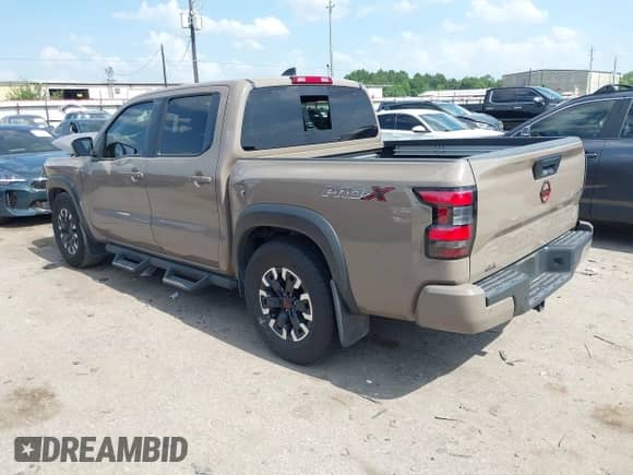 2023 Nissan Frontier Pro-X with VIN 1N6ED1EJXPN657609, listed as a IAAI auction lot 42852823 with 22,584 mi miles and . Bid and sale history available at DreamBid. Image 3.
