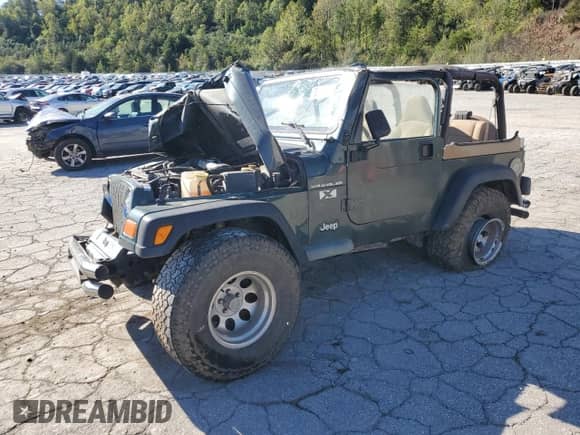 2002 Jeep Wrangler X z VIN 1J4FA39S12P776350, wystawiony jako Copart lot #82276415 z przebiegiem 196 023 mil mil oraz Szkoda całkowita • Salvage title. Historia ofert i sprzedaży dostępna na DreamBid. Obrazek 1.