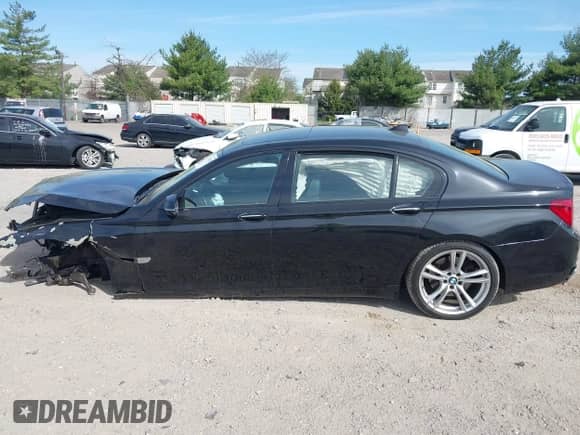 2015 BMW 7 Series with VIN WBAYG6C59FD383735, listed as a IAAI auction lot 42106255 with 107,936 mi miles and . Bid and sale history available at DreamBid. Image 14.