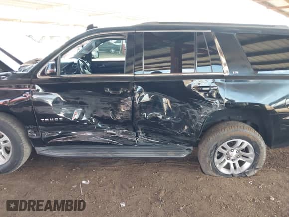 2015 Chevrolet Tahoe LS with VIN 1GNSCAKC0FR711917, listed as a IAAI auction lot 43241350 with 181,124 mi miles and . Bid and sale history available at DreamBid. Image 6.