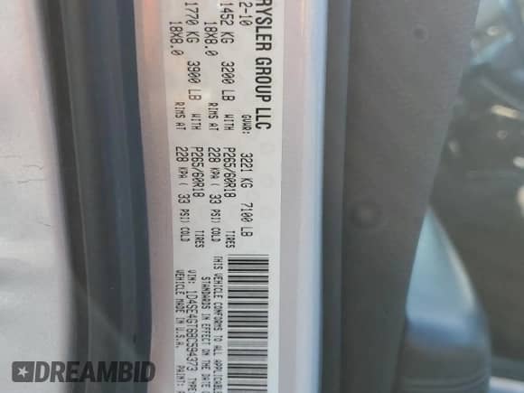 2011 Dodge Durango Crew with VIN 1D4SE4GT6BC594373, listed as a Copart auction lot 65832825 with 169,594 mi miles and Salvage title. Bid and sale history available at DreamBid. Image 13.