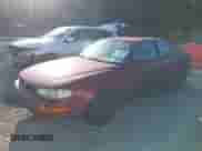 1992 Toyota Camry LE z VIN 4T1SK12E4NU036576, wystawiony jako IAAI lot #43436571 z przebiegiem 160 337 mil mil oraz . Historia ofert i sprzedaży dostępna na DreamBid. Obrazek 2.