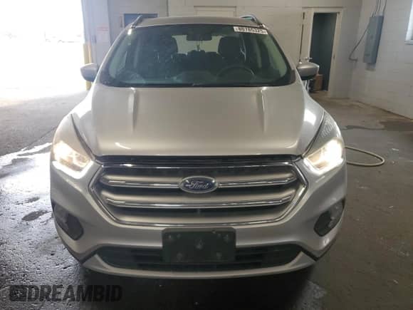 2017 Ford Escape SE z VIN 1FMCU9G91HUE87820, wystawiony jako Copart lot #80785325 z przebiegiem 118 426 mil mil oraz Szkoda całkowita • Salvage title. Historia ofert i sprzedaży dostępna na DreamBid. Obrazek 5.