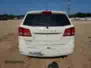 2014 Dodge Journey SE with VIN 3C4PDCAB5ET310739, listed as a Copart auction lot 69391595 with 128,134 mi miles and Salvage title. Bid and sale history available at DreamBid. Image 6.