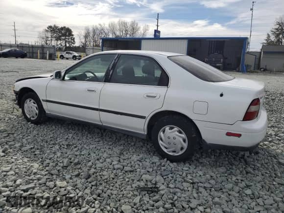 1994 Honda Accord LX с VIN 1HGCD5631RA175785, выставлен на аукционе Copart как лот 47111905 с пробегом 238 860 миль миль и Списание • Salvage title. История ставок и продаж доступна на DreamBid. Изображение 2.