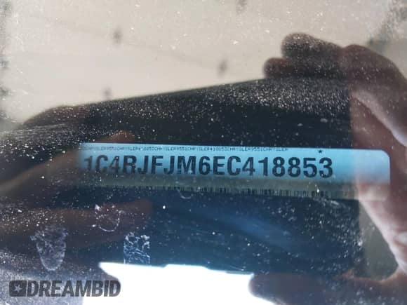 2014 Jeep Grand Cherokee Summit with VIN 1C4RJFJM6EC418853, listed as a IAAI auction lot 42787628 with 80,435 mi miles and . Bid and sale history available at DreamBid. Image 9.