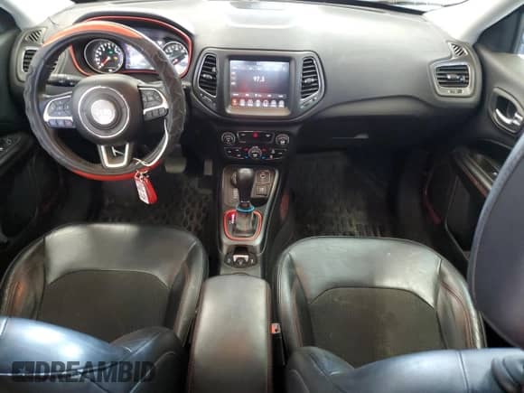 2017 Jeep Compass Trailhawk with VIN 3C4NJDDBXHT647011, listed as a Copart auction lot 65583185 with 106,438 mi miles and Salvage title. Bid and sale history available at DreamBid. Image 8.