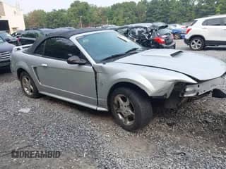 2003 Ford Mustang Deluxe z VIN 1FAFP44453F337765, wystawiony jako IAAI lot #42890625 z przebiegiem 129 007 mil mil oraz . Historia ofert i sprzedaży dostępna na DreamBid. Obrazek 1.