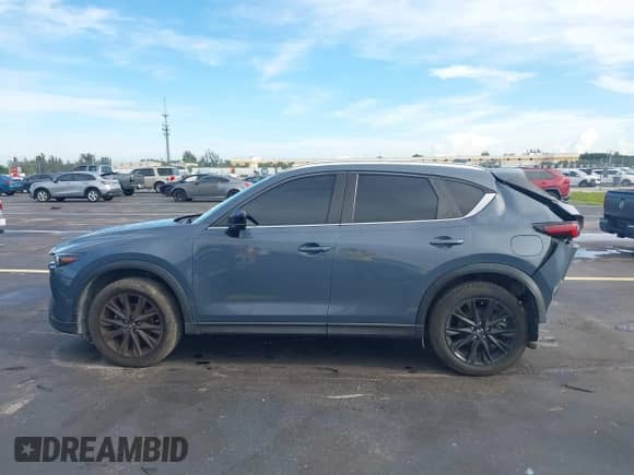 2022 Mazda CX-5 S Preferred z VIN JM3KFBCM3N0539261, wystawiony jako IAAI lot #43264779 z przebiegiem 60 847 mil mil oraz . Historia ofert i sprzedaży dostępna na DreamBid. Obrazek 14.