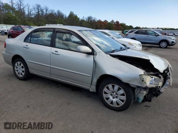 2003 Toyota Corolla LE with VIN JTDBR32E630035428, listed as a Copart auction lot 84373095 with 240,413 mi miles and Salvage title. Bid and sale history available at DreamBid. Image 4.