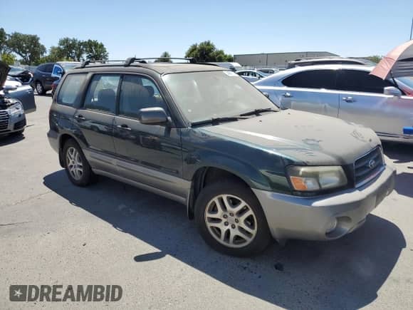 2005 Subaru Forester XS L.L. Bean with VIN JF1SG67665H736666, listed as a Copart auction lot 64097075 with 198,404 mi miles and Salvage title. Bid and sale history available at DreamBid. Image 4.