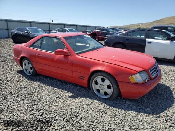 2000 Mercedes-Benz SL 500 with VIN WDBFA68F9YF190276, listed as a Copart auction lot 63057725 with Not provided miles and Salvage title. Bid and sale history available at DreamBid. Image 4.