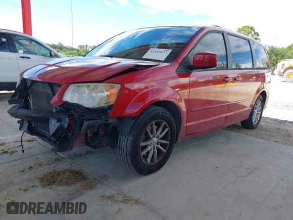 2014 Dodge Grand Caravan SXT with VIN 2C4RDGCG4ER129711, listed as a IAAI auction lot 43317873 with 164,242 mi miles and . Bid and sale history available at DreamBid. Image 2.