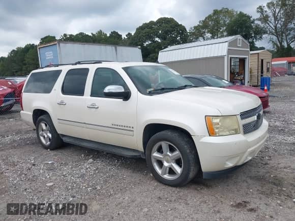 2009 Chevrolet Suburban LTZ with VIN 1GNFC36J39R242199, listed as a IAAI auction lot 43322206 with 306,353 mi miles and . Bid and sale history available at DreamBid. Image 1.