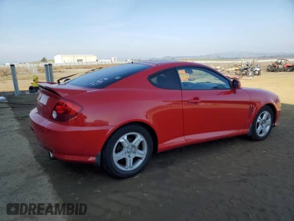 2003 Hyundai Tiburon GT с VIN KMHHN65F63U060104, выставлен на аукционе Copart как лот 84560184 с пробегом 160 120 миль миль и Чистый • Clean title. История ставок и продаж доступна на DreamBid. Изображение 3.