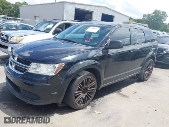 2016 Dodge Journey SE with VIN 3C4PDCAB0GT186124, listed as a IAAI auction lot 42958467 with 241,659 mi miles and . Bid and sale history available at DreamBid. Image 2.