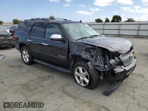 2007 Chevrolet Tahoe LTZ with VIN 1GNFC13J87R394792, listed as a Copart auction lot 85131395 with 191,795 mi miles and Salvage title. Bid and sale history available at DreamBid. Image 4.