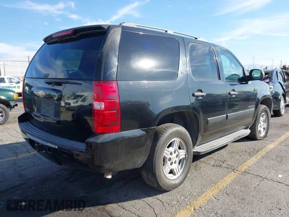 2007 Chevrolet Tahoe LS with VIN 1GNFC13C27R347789, listed as a IAAI auction lot 43595543 with 255,773 mi miles and . Bid and sale history available at DreamBid. Image 4.