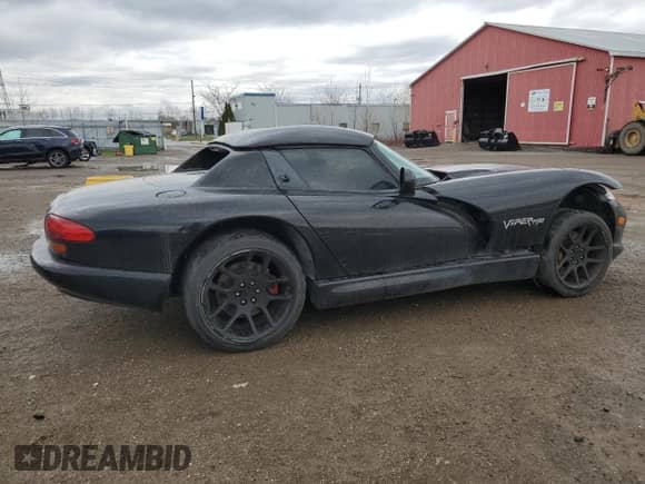 1999 Dodge Viper RT/10 с VIN 1B3ER65E0XV504078, выставлен на аукционе Copart как лот 54338855 с пробегом Не указан миль и На запчасти • Non repairable. История ставок и продаж доступна на DreamBid. Изображение 3.