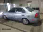 2005 Hyundai Accent GLS z VIN KMHCG45C65U662633, wystawiony jako Copart lot #86432595 z przebiegiem 221 608 mil mil oraz Szkoda całkowita • Salvage title. Historia ofert i sprzedaży dostępna na DreamBid. Obrazek 2.