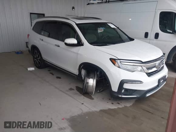 2020 Honda Pilot Touring 7-Passenger z VIN 5FNYF5H60LB026398, wystawiony jako IAAI lot #41294517 z przebiegiem 52 917 mil mil oraz . Historia ofert i sprzedaży dostępna na DreamBid. Obrazek 1.