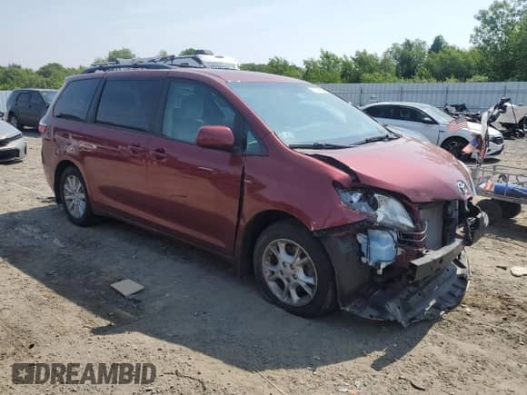 2016 Toyota Sienna LE with VIN 5TDJK3DC5GS129072, listed as a Copart auction lot 54304695 with 161,167 mi miles and Salvage title. Bid and sale history available at DreamBid. Image 4.