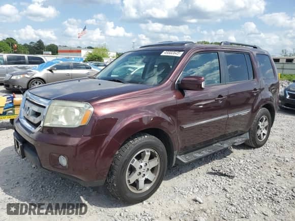 2010 Honda Pilot Touring with VIN 5FNYF3H90AB002579, listed as a Copart auction lot 49802645 with Not provided miles and Salvage title. Bid and sale history available at DreamBid. Image 1.