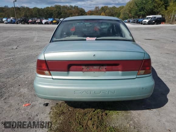 1997 Saturn SL с VIN 1G8ZK5274VZ271990, выставлен на аукционе Copart как лот 87279155 с пробегом 147 825 миль миль и Списание • Salvage title. История ставок и продаж доступна на DreamBid. Изображение 6.